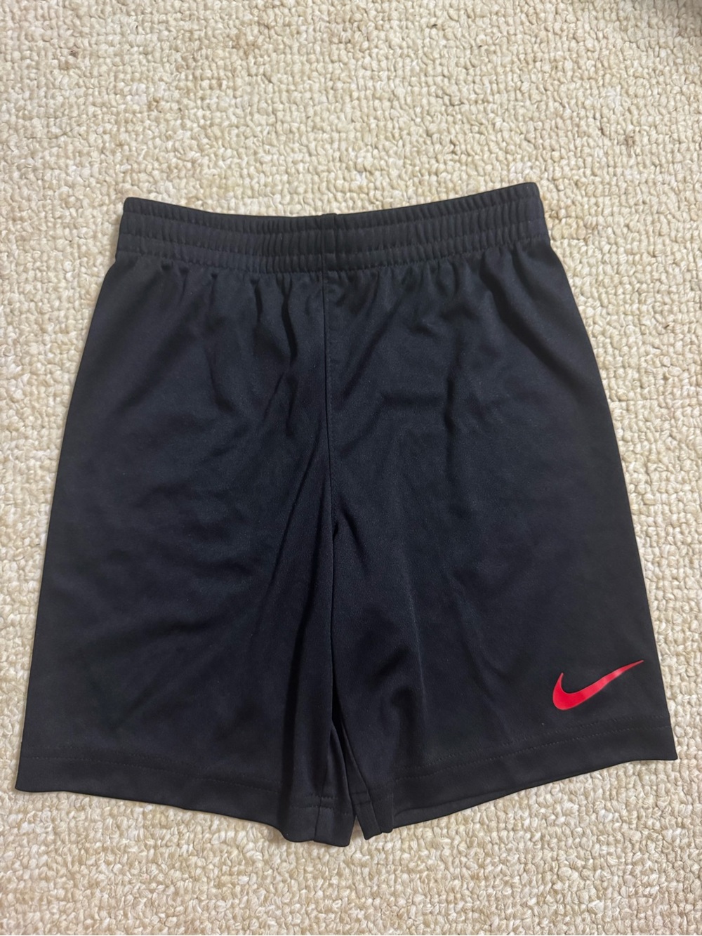 Nike Black Sports Shorts with Red Swoosh Accent